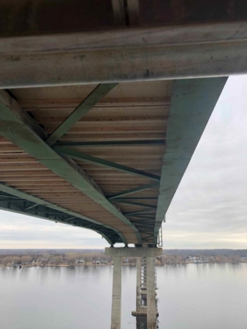 Containment system of false deck for bridge deck removal