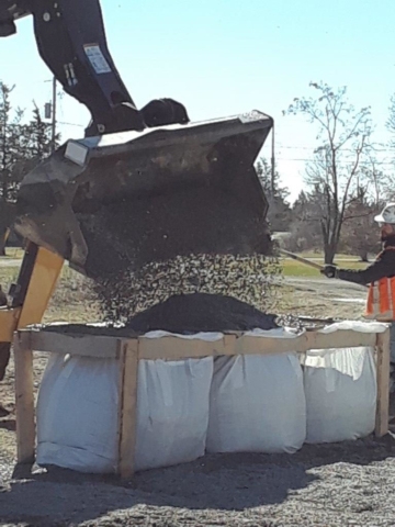 Filling gravel bags for shoreline