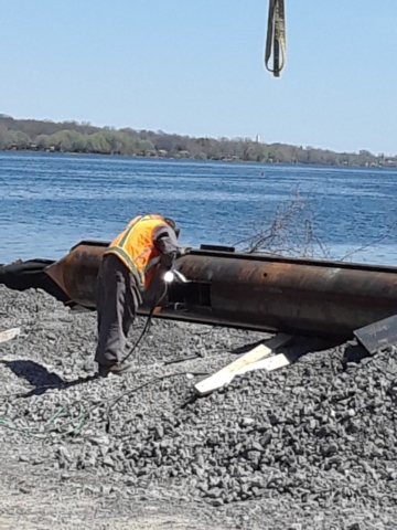 Retrofitting new spuds for barge