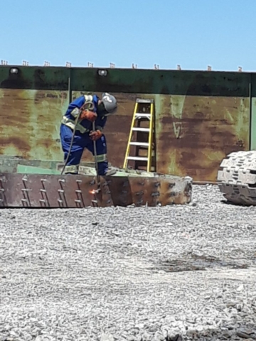 Section of girder being cut for removal from site