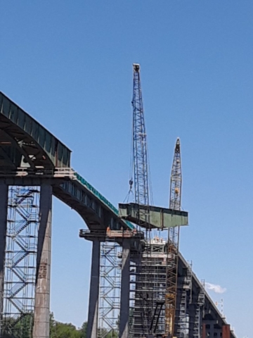 Girder being lowered to the barge