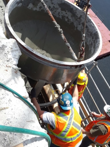 Concrete being poured in to the form