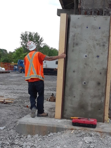 Concrete forms being removed after concrete is cured