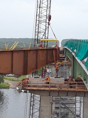 New girder being lowered onto pier cap