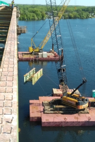 Girder being lowered to the barge