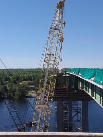 Cutting and hooking up crane cables to girder for removal