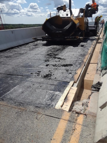 First lift of asphalt being placed