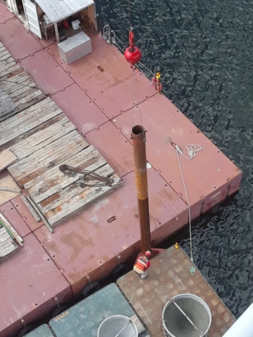 Barge spud being raised in order to move the barge