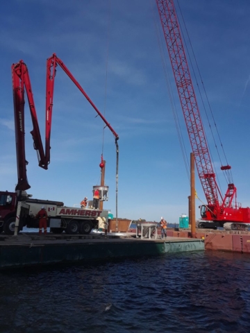 View of the two barges housing one of the cranes and the concrete pump truck