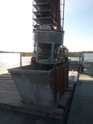 Unused concrete being removed from bucket