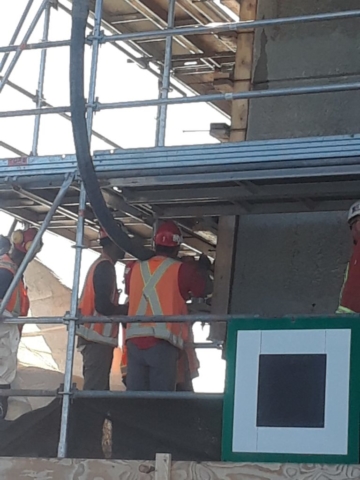 Concrete being pumped into the forms on pier 7 - Outside view