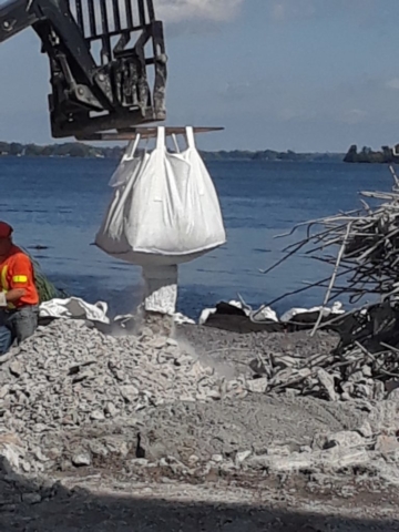 Rubble removed from deck being offloaded for sorting