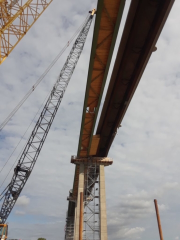 View of the completed east side of the bridge and the girders on the west side to be removed