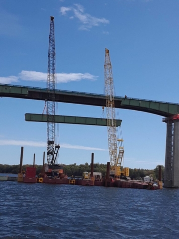 First section of girder starting to be lowered