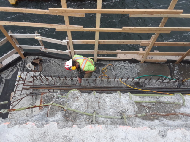 Bush hammering of the existing concrete on pier 11