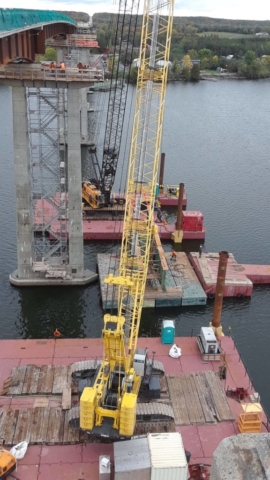 Hammer Head girder being placed on the barge