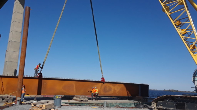 New girder being placed on barge to be assembled