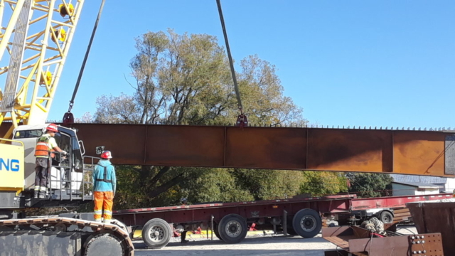 New girder being delivered and removed from the truck