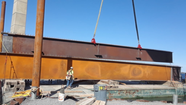 Second section of the girder being moved into place to be assembled