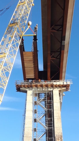 Hammer Head girder being placed on the pier cap /underneath view