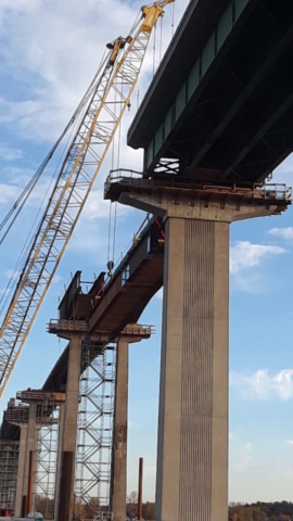 Approach girder being lifted into place / view from the west side of the bridge