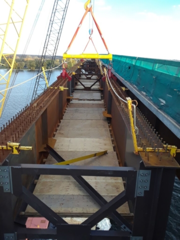 Approach girder being lowered into place / top view