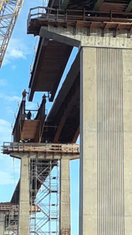 Approach girder being lowered into place / view from below