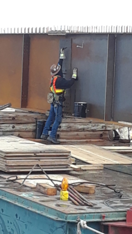 Bolting the splice plates on the girder