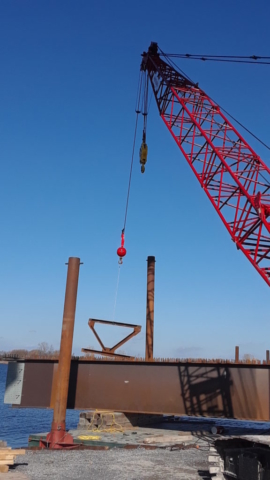 Bracing being lowered into girder sections for assembly