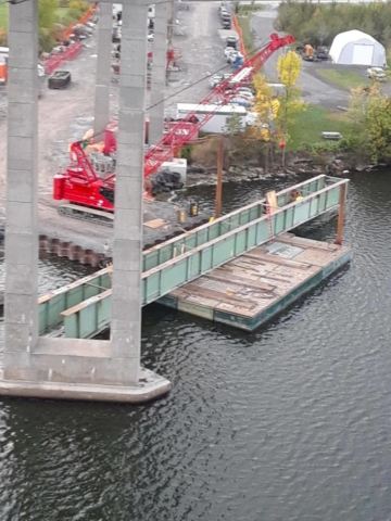 Large section of removed girder on the barge waiting to be dismantled