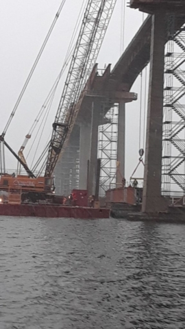 Preparing to lift the drop-in section of girder