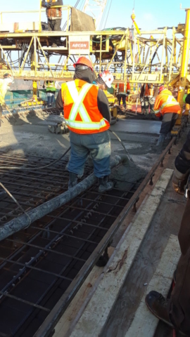 Concrete being pumped into the deck forms