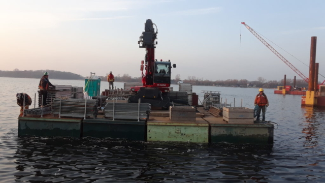 Barge bringing in removed scaffolding for the winter