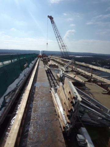 Brackets and material being lifted to the deck