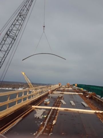 Rebar being lowered onto the deck by crane