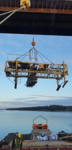 Concrete finisher lifted to deck