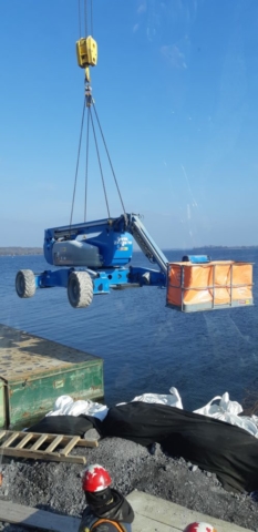 Man lift being removed from the barge