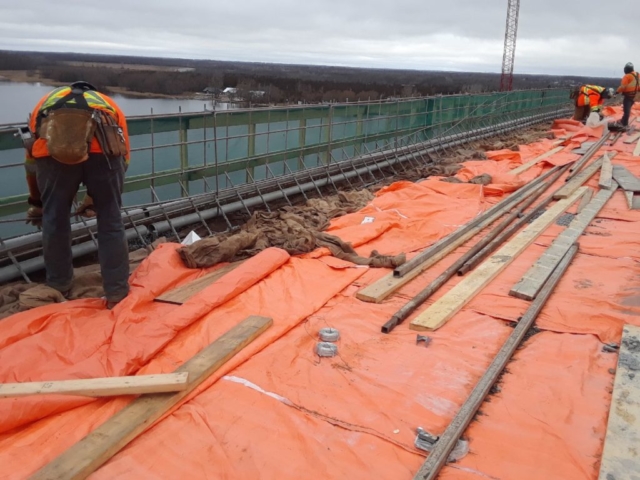 Stainless steel reinforcement for barrier wall on deck