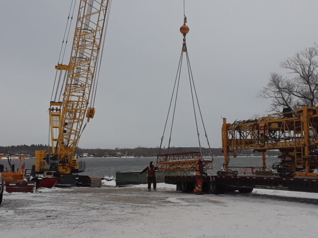 Concrete finisher being loaded on to the truck for removal