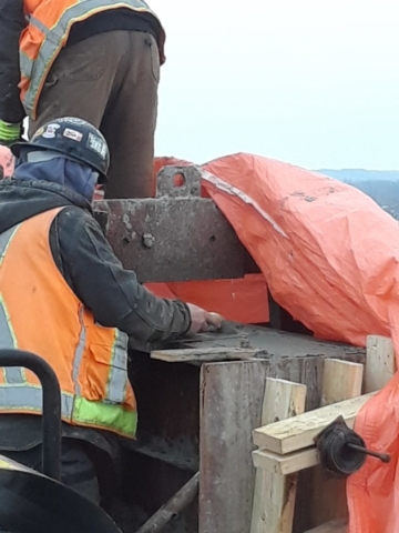 Finishing - leveling the top of the barrier wall