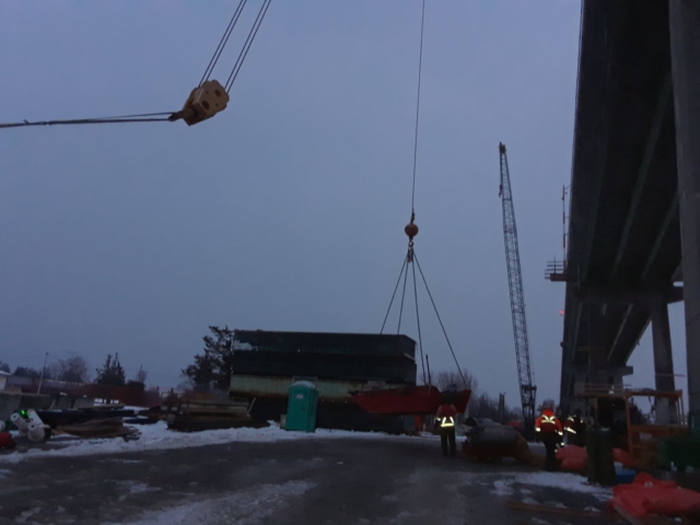 Small boat being lowered on site to be warmed by the frost heater