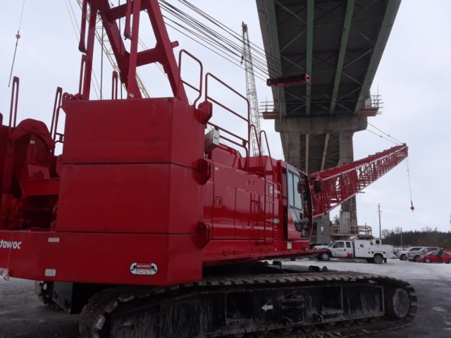 Crane being moved under the bridge