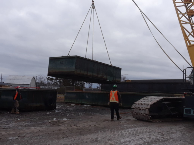 Barge piece being lifted and moved