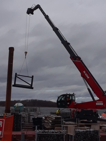 Scaffolding removed from the pier being unloaded off the barge