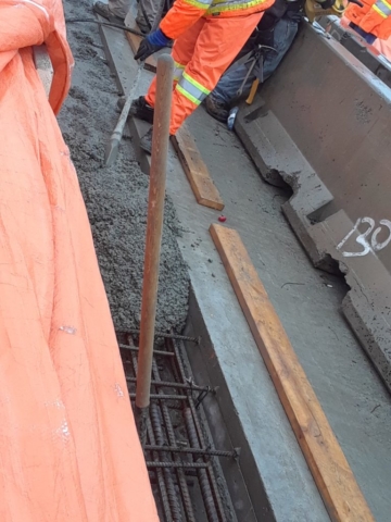 Placing concrete in the closure strip forms