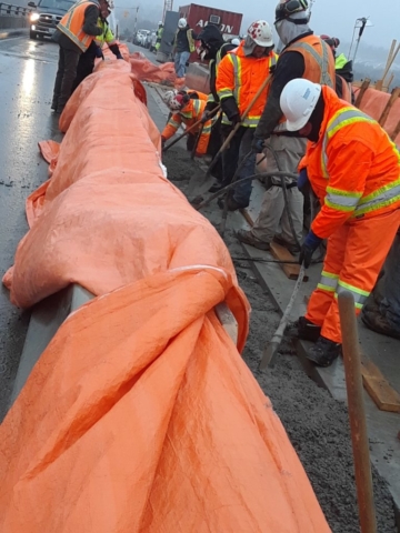 Vibrating the freshly placed concrete