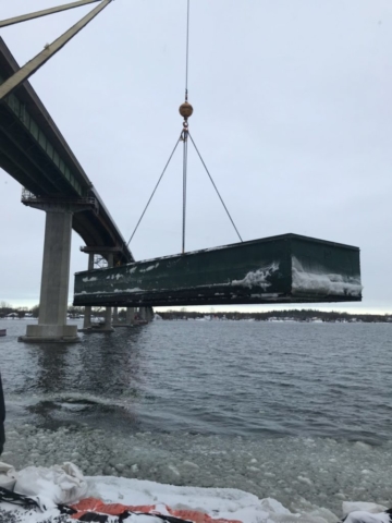 Barge piece being removed from the bay