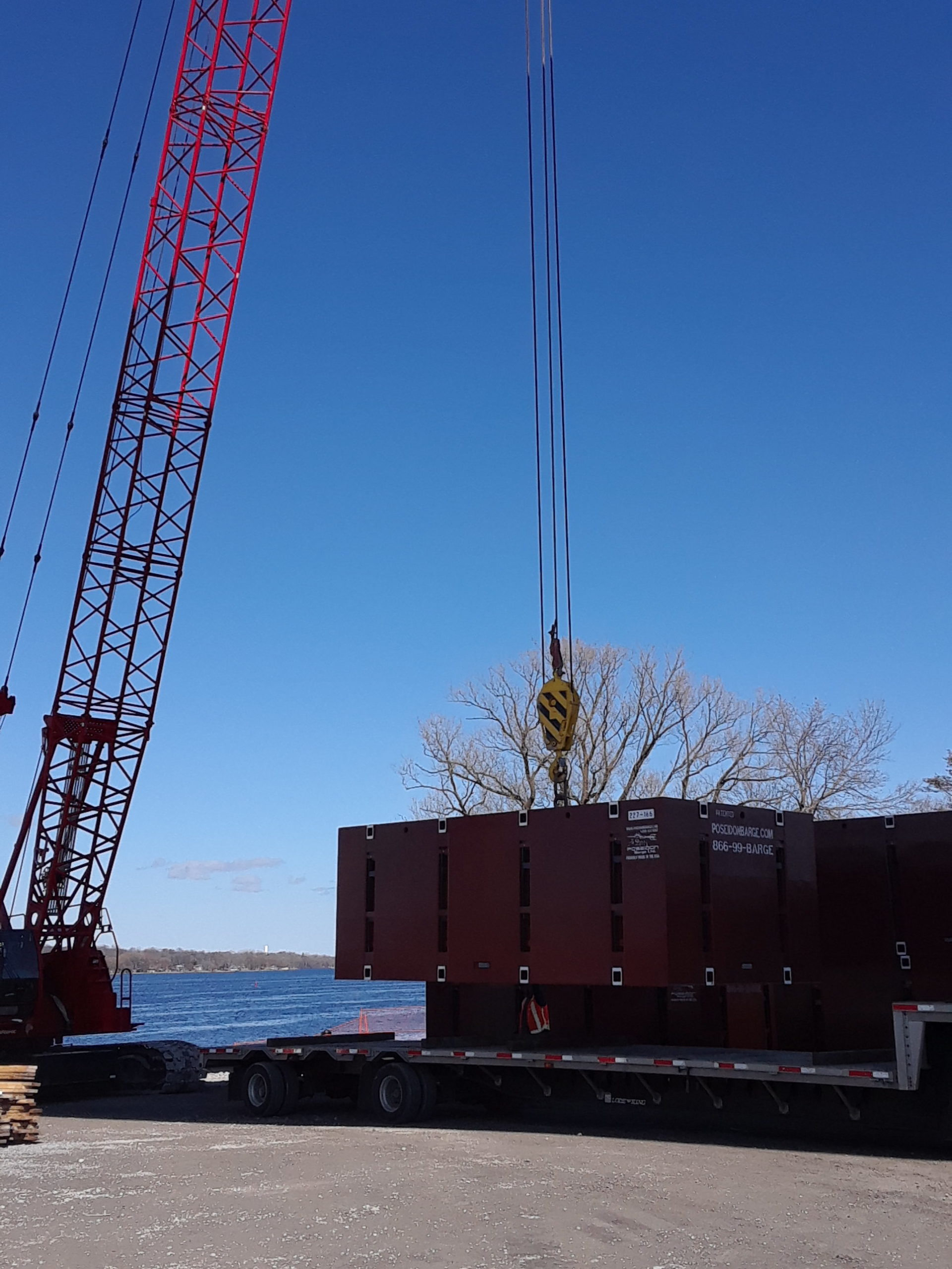 New barge pieces being offloaded by the 110 ton crane
