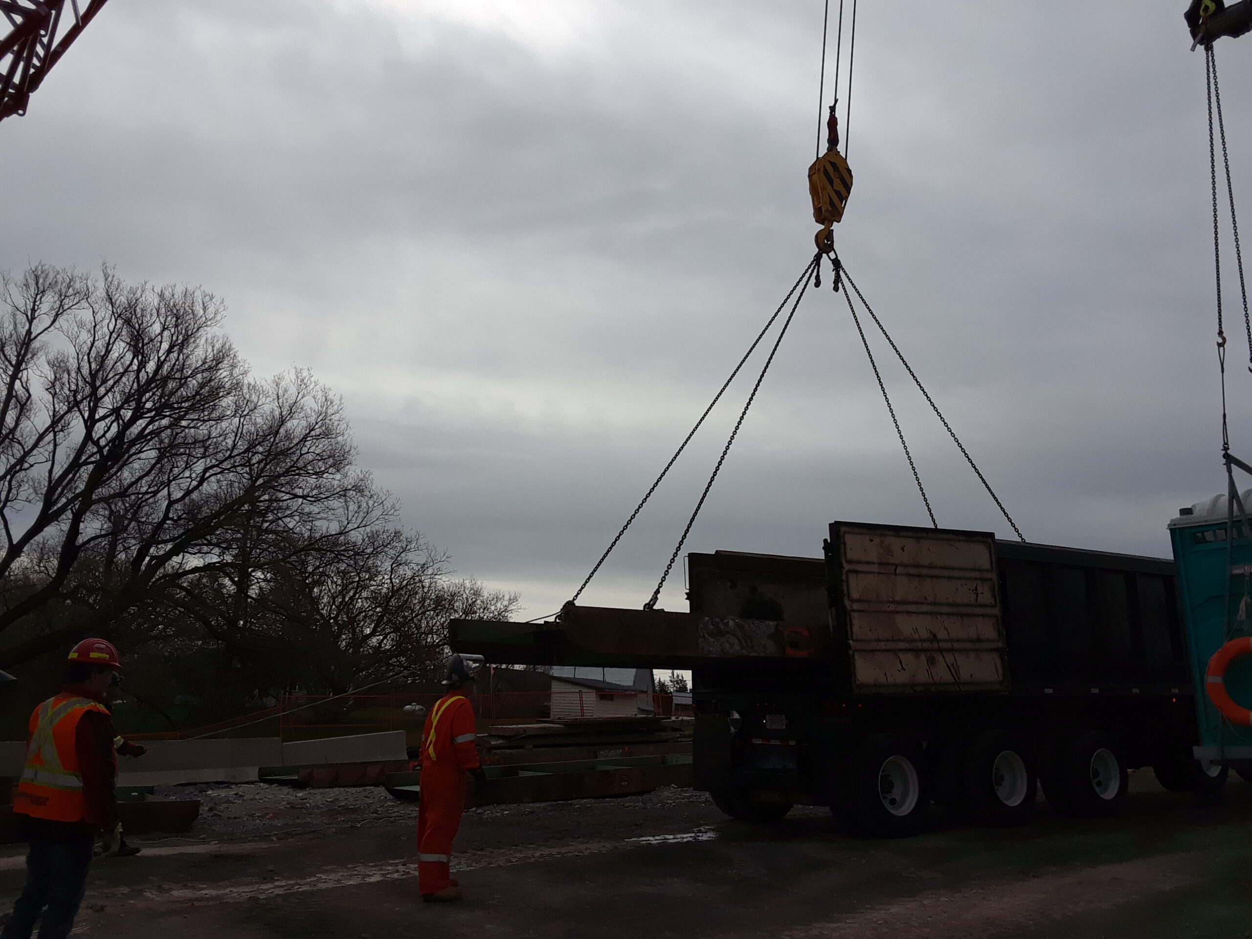 Loading the dismantled girder sections for removal from site