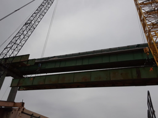 Lowering the fourth section of girder